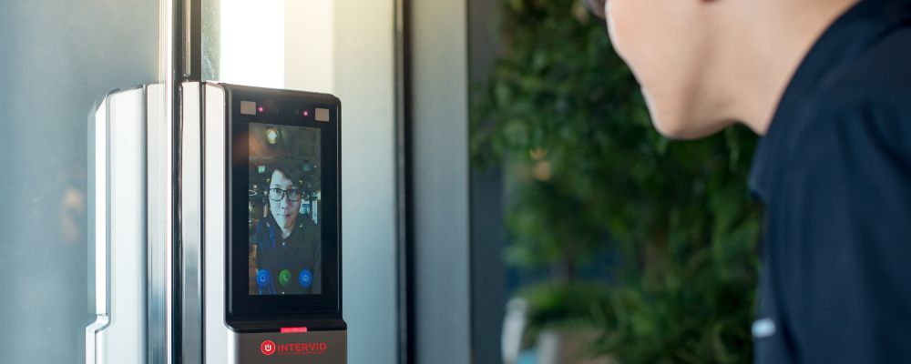 Man scanning face at facial recognition controlled access point